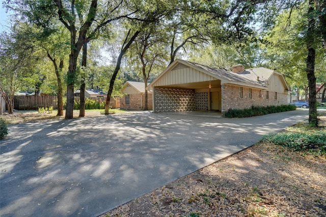 ranch-style home with a carport