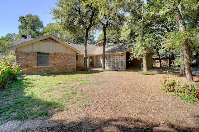 ranch-style house with a front yard