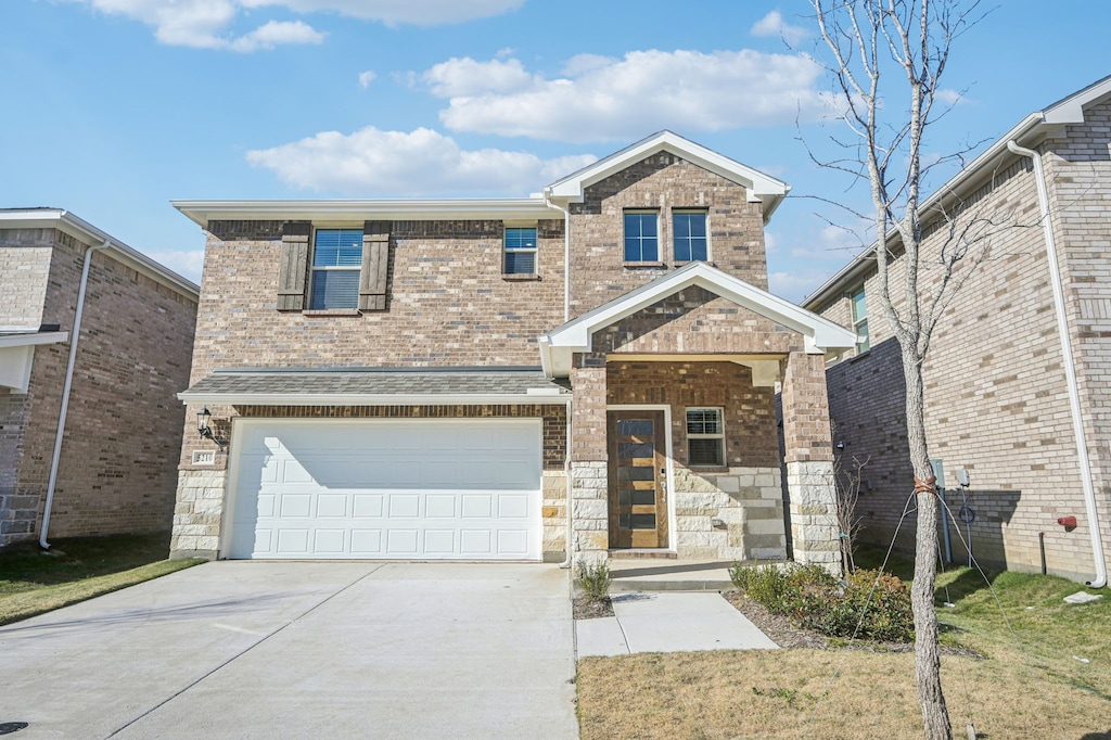 view of front of home with a garage