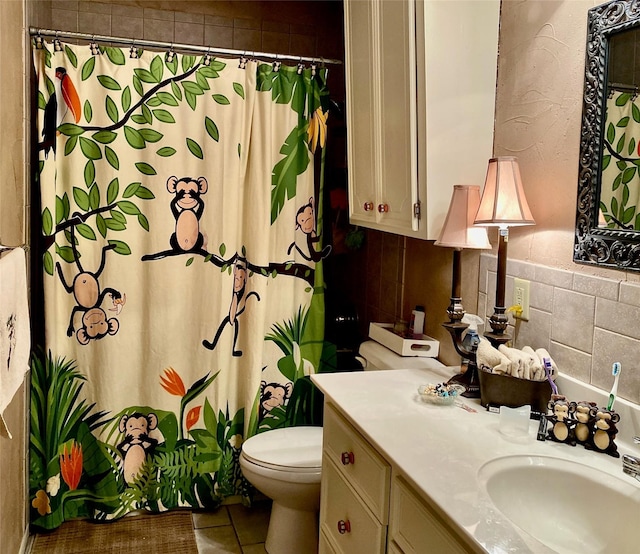 bathroom with tile patterned floors, vanity, toilet, and a shower with curtain