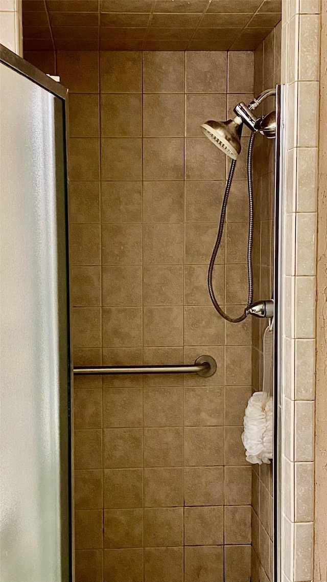 bathroom with a tile shower