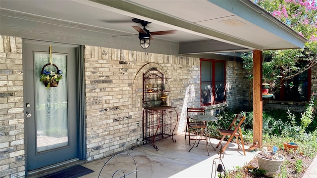 view of patio / terrace featuring ceiling fan