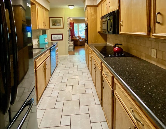 kitchen featuring decorative backsplash, light tile patterned floors, and black appliances