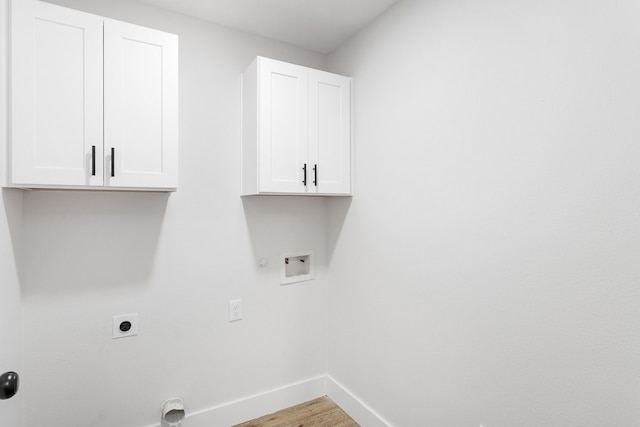 laundry room with cabinets, washer hookup, light hardwood / wood-style floors, electric dryer hookup, and gas dryer hookup