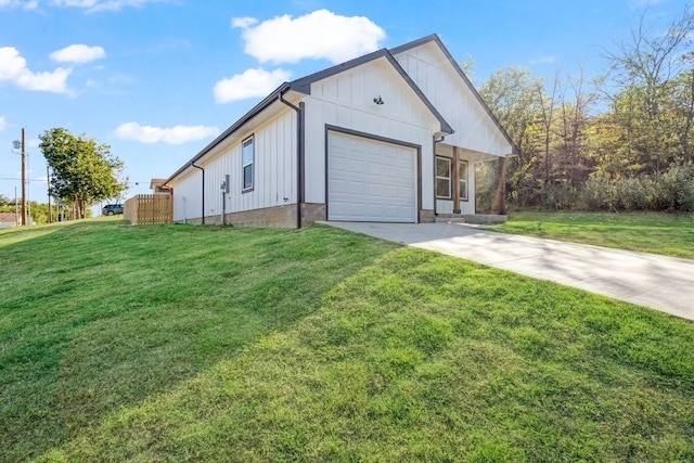 exterior space featuring a front lawn and a garage