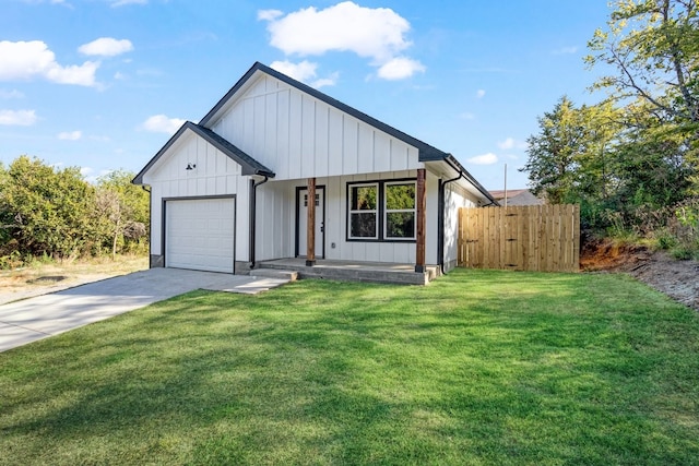 modern farmhouse style home with a front yard and a garage