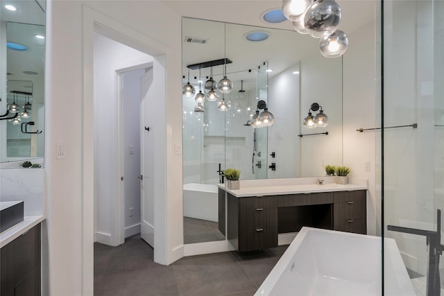 bathroom featuring vanity, concrete floors, and a tub