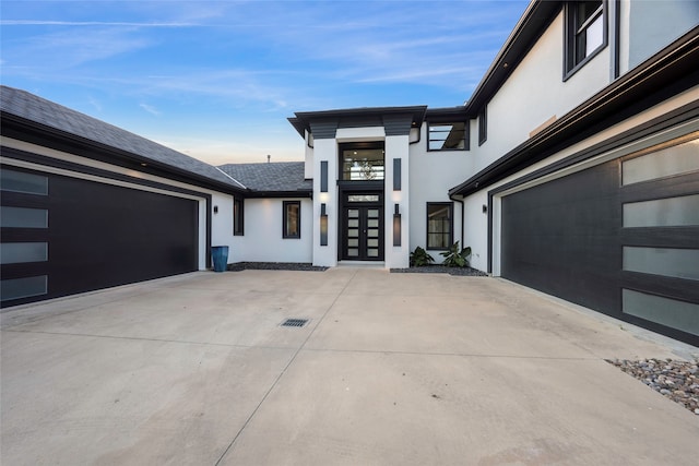 view of exterior entry featuring a garage