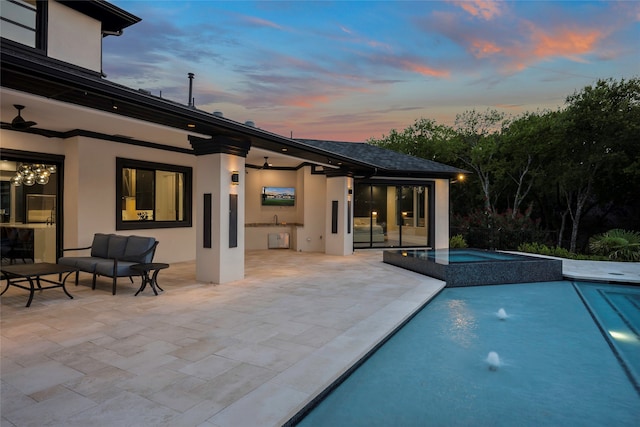 view of pool with an in ground hot tub and a patio area