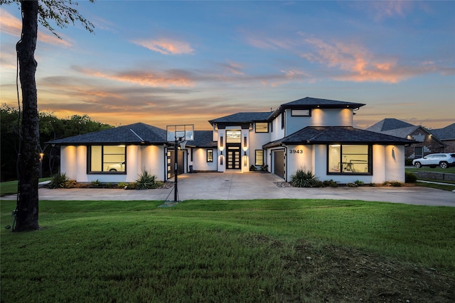 prairie-style home featuring a lawn