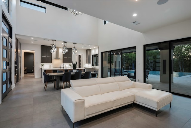 living room with a towering ceiling