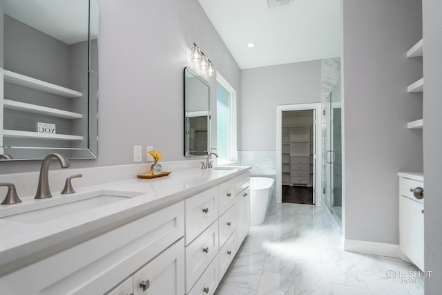 bathroom with vanity and independent shower and bath