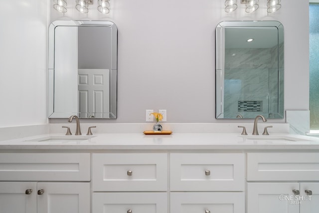 bathroom with vanity and walk in shower