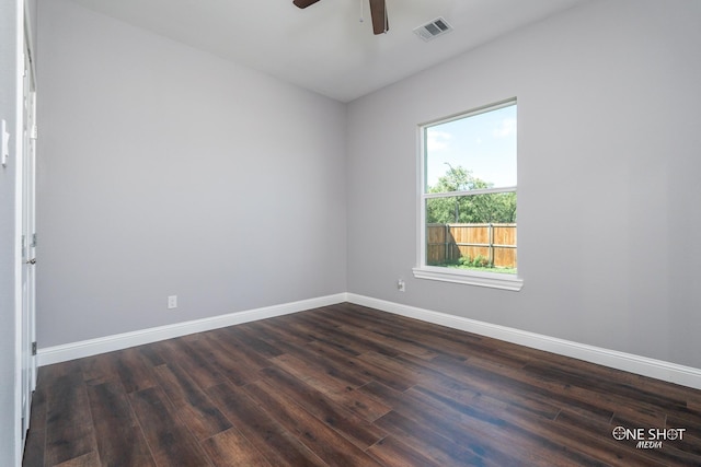 spare room with ceiling fan and dark wood-type flooring