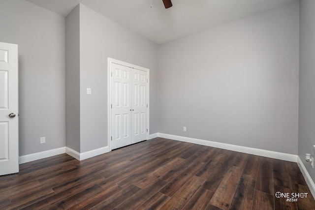 unfurnished bedroom featuring dark hardwood / wood-style flooring, a closet, and ceiling fan