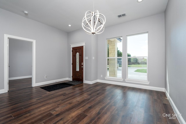 802 Waters Edge Dr, Abilene, TX 79602 - foyer featuring an inviting chandelier, baseboards, dark wood-style flooring, and visible vents