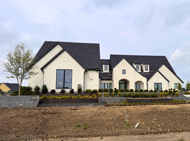 view of front facade featuring brick siding