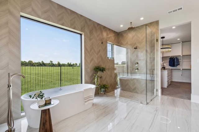 1644 Aster Way, Celina, TX 75009 - bathroom with a stall shower, a freestanding bath, and recessed lighting