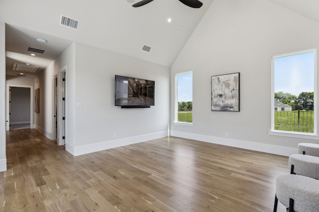 1644 Aster Way, Celina, TX 75009 - unfurnished living room with high vaulted ceiling, healthy amount of natural light, a ceiling fan, and light wood-style floors