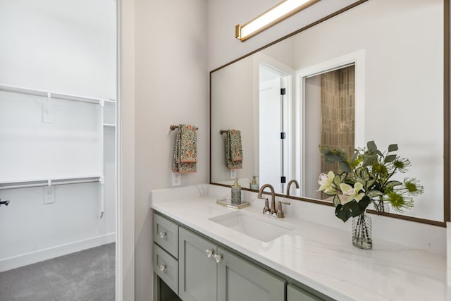 1644 Aster Way, Celina, TX 75009 - bathroom with vanity, a spacious closet, and baseboards