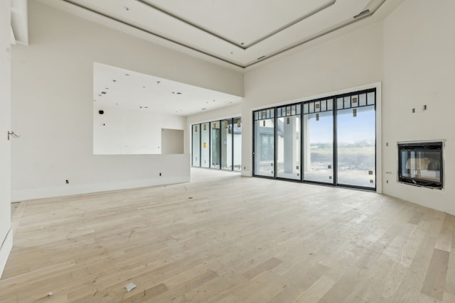 unfurnished living room featuring light hardwood / wood-style floors