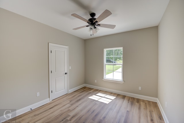 spare room with ceiling fan and light hardwood / wood-style flooring