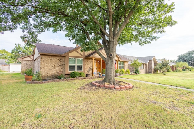 single story home featuring a front lawn