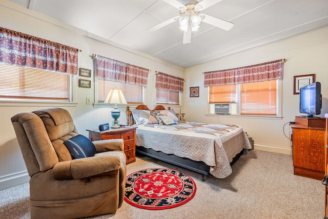 carpeted bedroom with cooling unit and ceiling fan