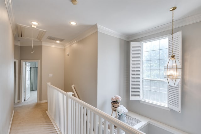 corridor with light carpet and crown molding