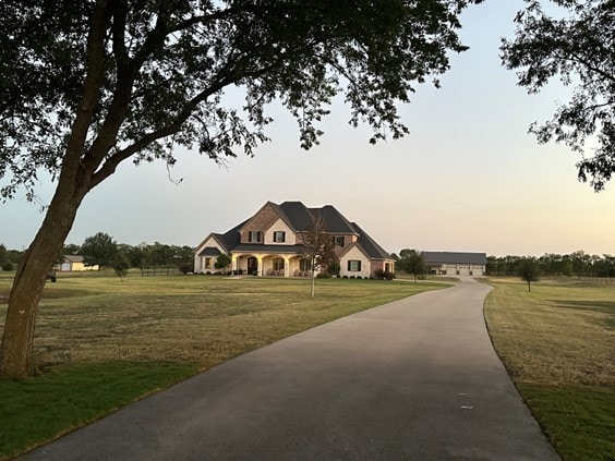 view of front of house with a lawn