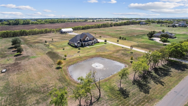 birds eye view of property featuring a rural view