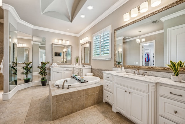 bathroom featuring tile patterned flooring, a relaxing tiled tub, a notable chandelier, vanity, and ornamental molding