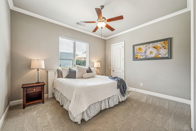 carpeted bedroom featuring ceiling fan and crown molding