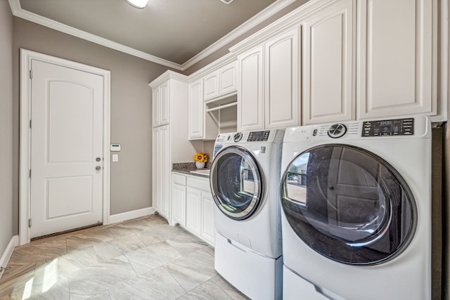 clothes washing area featuring cabinets, separate washer and dryer, and crown molding