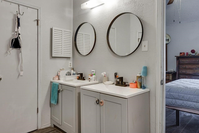 613 Purple Sage Trl, Mesquite, TX 75149 - full bath featuring two vanities and wood finished floors