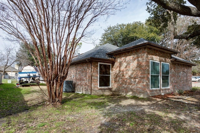 view of side of home featuring a lawn