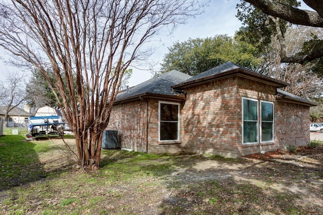 613 Purple Sage Trl, Mesquite, TX 75149 - view of side of property featuring brick siding and a shingled roof
