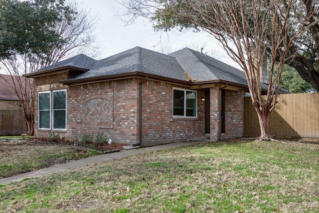 613 Purple Sage Trl, Mesquite, TX 75149 - view of side of property featuring a shingled roof and brick siding