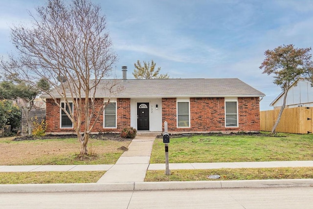 single story home with a front lawn