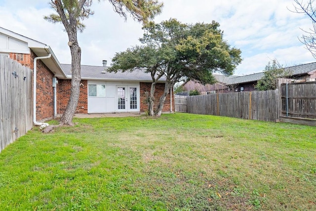 view of yard with french doors