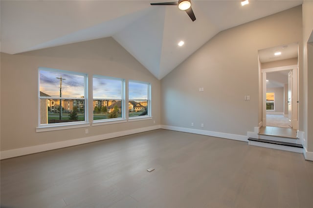 unfurnished living room featuring high vaulted ceiling, ceiling fan, and hardwood / wood-style flooring