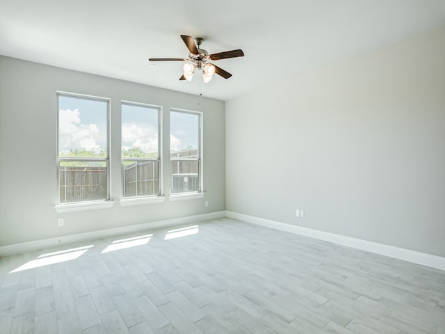 unfurnished room with ceiling fan and light hardwood / wood-style floors