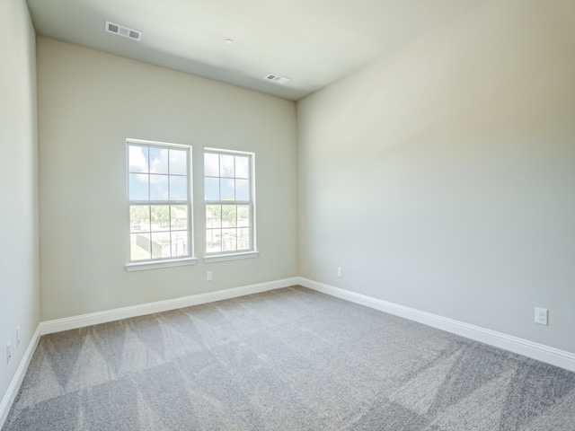 unfurnished room with carpet flooring