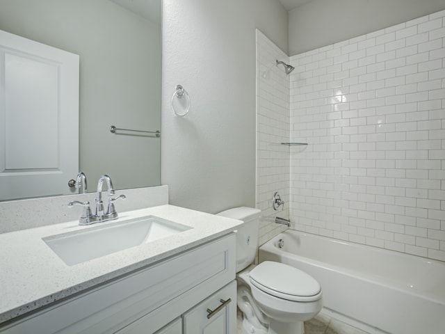 full bathroom with vanity, toilet, and tiled shower / bath