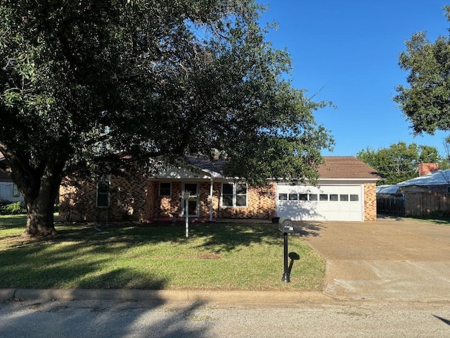 view of front of house with a garage and a front yard