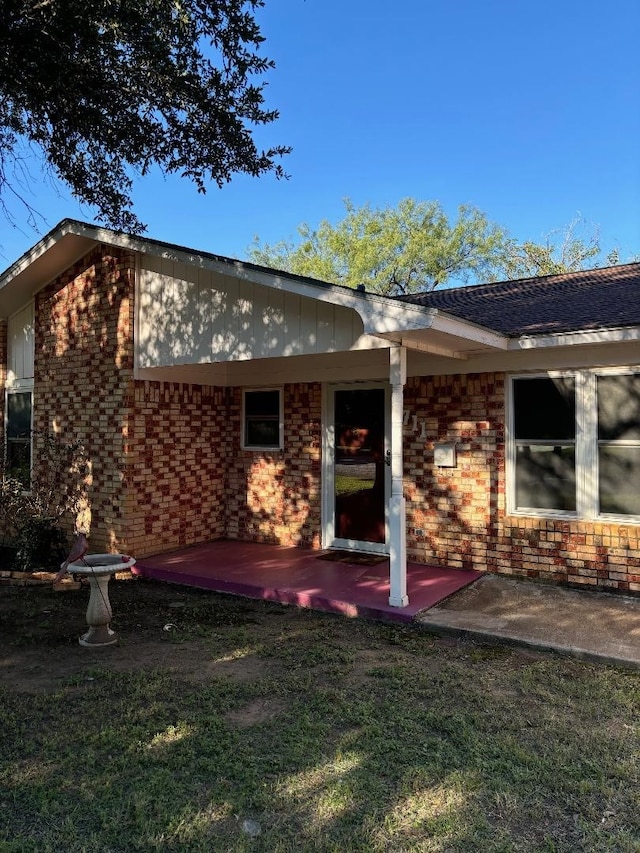 rear view of house with a yard