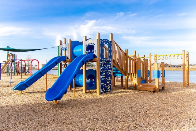 view of jungle gym featuring a water view