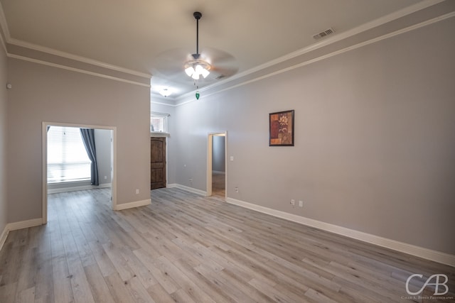 empty room with light hardwood / wood-style flooring, ceiling fan, and ornamental molding