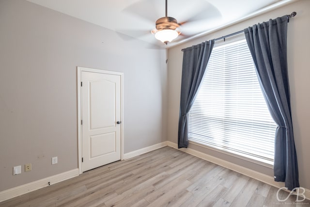 unfurnished room with light hardwood / wood-style flooring and ceiling fan