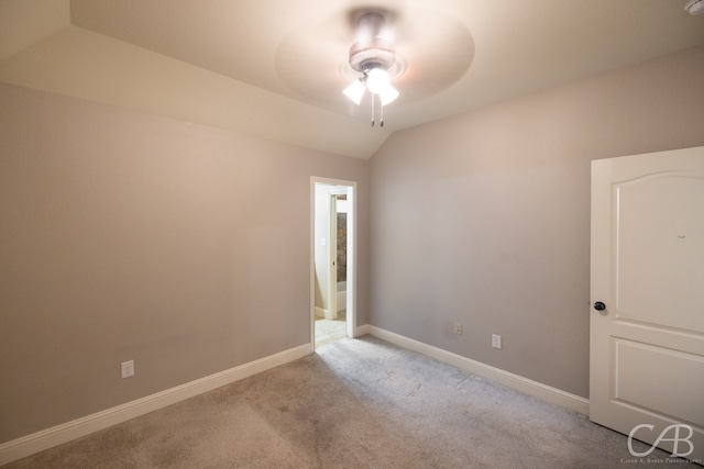 carpeted empty room with lofted ceiling and ceiling fan